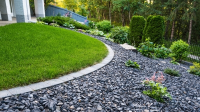 Planted garden with gravel and grass. Photo
